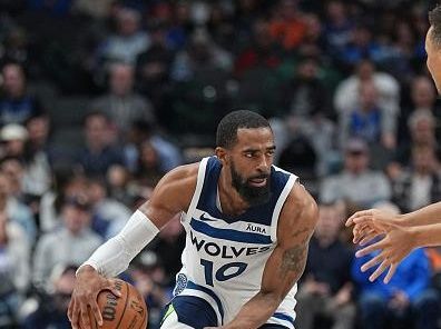 DALLAS, TX - DECEMBER 14: Mike Conley #10 of the Minnesota Timberwolves dribbles the ball during the game against the Dallas Mavericks on December 14, 2023 at the American Airlines Center in Dallas, Texas. NOTE TO USER: User expressly acknowledges and agrees that, by downloading and or using this photograph, User is consenting to the terms and conditions of the Getty Images License Agreement. Mandatory Copyright Notice: Copyright 2023 NBAE (Photo by Glenn James/NBAE via Getty Images)