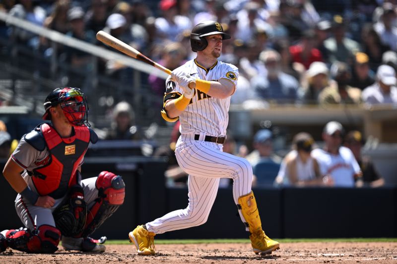 Apr 19, 2023; San Diego, California, USA; San Diego Padres first baseman Jake Cronenworth (9) hits a double against the Atlanta Braves during the fourth inning at Petco Park. Mandatory Credit: Orlando Ramirez-USA TODAY Sports