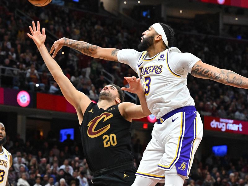 CLEVELAND, OHIO - NOVEMBER 25: Georges Niang #20 of the Cleveland Cavaliers shoots over Anthony Davis #3 of the Los Angeles Lakers during the third quarter at Rocket Mortgage Fieldhouse on November 25, 2023 in Cleveland, Ohio. The Lakers defeated the Cavaliers 121-115. NOTE TO USER: User expressly acknowledges and agrees that, by downloading and or using this photograph, User is consenting to the terms and conditions of the Getty Images License Agreement. (Photo by Jason Miller/Getty Images)
