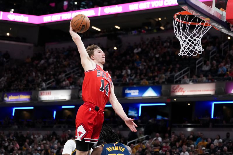 INDIANAPOLIS, INDIANA - MARCH 02: Matas Buzelis #14 of the Chicago Bulls dunks the ball over Aaron Nesmith #23 of the Indiana Pacers in the third quarter at Gainbridge Fieldhouse on March 02, 2025 in Indianapolis, Indiana. NOTE TO USER: User expressly acknowledges and agrees that, by downloading and or using this photograph, User is consenting to the terms and conditions of the Getty Images License Agreement. (Photo by Dylan Buell/Getty Images)