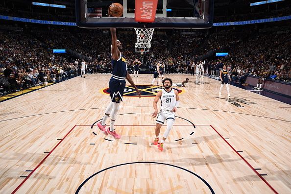 DENVER, CO - DECEMBER 28:Justin Holiday #9 of the Denver Nuggets drives to the basket during the game against the Memphis Grizzlies on December 28, 2023 at the Ball Arena in Denver, Colorado. NOTE TO USER: User expressly acknowledges and agrees that, by downloading and/or using this Photograph, user is consenting to the terms and conditions of the Getty Images License Agreement. Mandatory Copyright Notice: Copyright 2023 NBAE (Photo by Garrett Ellwood/NBAE via Getty Images)