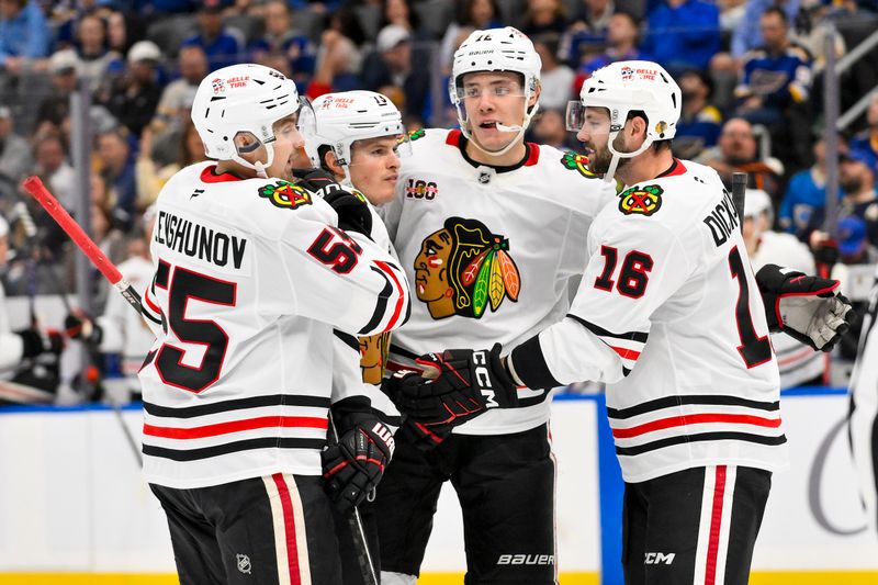 Oct 15, 2025; St. Louis, Missouri, USA; Chicago Blackhawks left wing Lukas Reichel (73) is congratulated by teammates after scoring against the St. Louis Blues during the second period at Enterprise Center. Mandatory Credit: Jeff Curry-Imagn Images