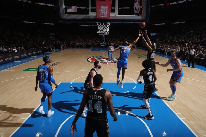 OKLAHOMA CITY, OK - APRIL 10:  Malaki Branham #22 of the San Antonio Spurs and Isaiah Joe #11 of the Oklahoma City Thunder battle for a rebound on April 10, 2024 at Paycom Arena in Oklahoma City, Oklahoma. NOTE TO USER: User expressly acknowledges and agrees that, by downloading and or using this photograph, User is consenting to the terms and conditions of the Getty Images License Agreement. Mandatory Copyright Notice: Copyright 2024 NBAE (Photo by Zach Beeker/NBAE via Getty Images)