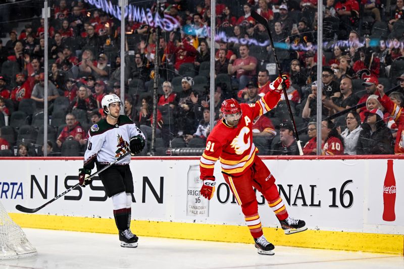 Apr 14, 2024; Calgary, Alberta, CAN; Calgary Flames center Nazem Kadri (91) celebrates after scoring a goal against the Arizona Coyotes during the third period at Scotiabank Saddledome. Mandatory Credit: Brett Holmes-USA TODAY Sports