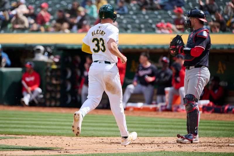 Apr 14, 2024; Oakland, California, USA; Oakland Athletics outfielder JJ Bleday (33) scores a run against the Washington Nationals during the sixth inning at Oakland-Alameda County Coliseum. Mandatory Credit: Robert Edwards-USA TODAY Sports