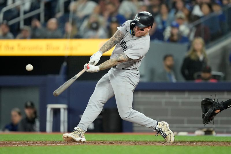 Apr 16, 2024; Toronto, Ontario, CAN; New York Yankees left fielder Alex Verdugo (24) hits a double against the Toronto Blue Jays during the ninth inning at Rogers Centre. Mandatory Credit: John E. Sokolowski-USA TODAY Sports