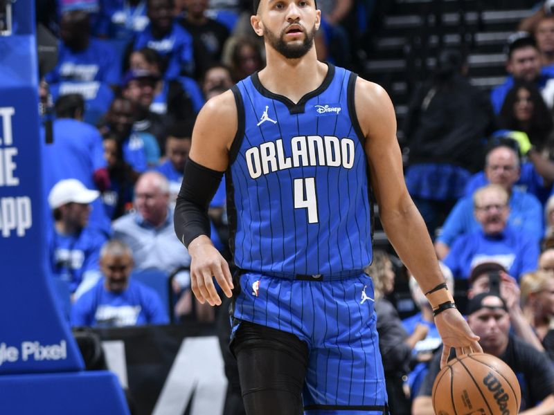 ORLANDO, FL - APRIL 25: Jalen Suggs #4 of the Orlando Magic handles the ball during the game  against the Cleveland Cavaliers during Round 1 Game 3 of the 2024 NBA Playoffs on April 25, 2024 at Kia Center in Orlando, Florida. NOTE TO USER: User expressly acknowledges and agrees that, by downloading and or using this photograph, User is consenting to the terms and conditions of the Getty Images License Agreement. Mandatory Copyright Notice: Copyright 2023 NBAE (Photo by Fernando Medina/NBAE via Getty Images)