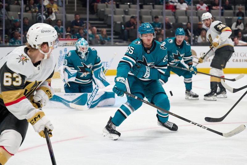 Sep 26, 2025; San Jose, California, USA; San Jose Sharks defenseman Shakir Mukhamadullin (85) blocks a shot against Vegas Golden Knights right wing Ben Hemmerling (63) during the third period at SAP Center at San Jose. Mandatory Credit: Robert Edwards-Imagn Images