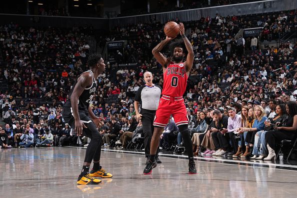 BROOKLYN, NY - NOVEMBER 26: Coby White #0 of the Chicago Bulls looks to pass the ball during the game against the Brooklyn Nets on November 26, 2023 at Barclays Center in Brooklyn, New York. NOTE TO USER: User expressly acknowledges and agrees that, by downloading and or using this Photograph, user is consenting to the terms and conditions of the Getty Images License Agreement. Mandatory Copyright Notice: Copyright 2023 NBAE (Photo by Jesse D. Garrabrant/NBAE via Getty Images)