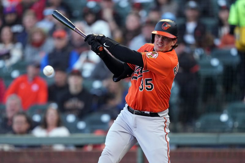 Jun 3, 2023; San Francisco, California, USA;  Baltimore Orioles catcher Adley Rutschman (35) hits an infield single against the San Francisco Giants during the first inning at Oracle Park. Mandatory Credit: Darren Yamashita-USA TODAY Sports