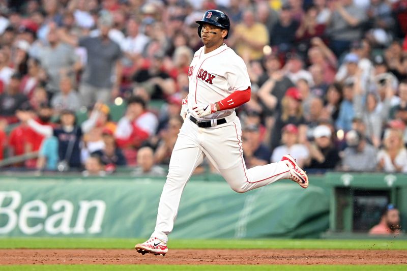 May 31, 2023; Boston, Massachusetts, USA; Boston Red Sox third baseman Rafael Devers (11) runs towards second base after hitting a RBI double against the Cincinnati Reds during the third inning at Fenway Park. Mandatory Credit: Brian Fluharty-USA TODAY Sports