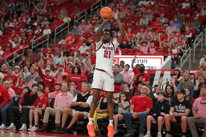 Mar 7, 2026; Raleigh, North Carolina, USA;  NC State Wolfpack guard Terrance Arceneaux (21) shoots the ball during the first half against the Stanford Cardinal at Lenovo Center. Mandatory Credit: Zachary Taft-Imagn Images