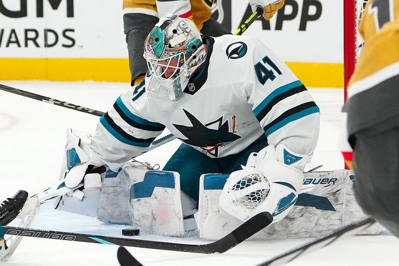 Oct 26, 2024; Las Vegas, Nevada, USA; San Jose Sharks goaltender Vitek Vanecek (41) make a save against the Vegas Golden Knights during the second period at T-Mobile Arena. Mandatory Credit: Stephen R. Sylvanie-Imagn Images