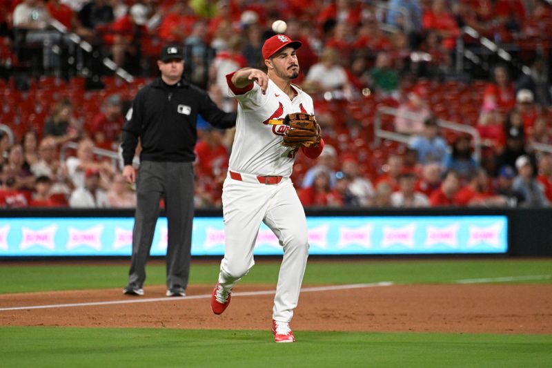 Sep 6, 2024; St. Louis, Missouri, USA; St. Louis Cardinals third baseman Nolan Arenado (28) throws to first for an out against the Seattle Mariners in the third inning at Busch Stadium. Mandatory Credit: Joe Puetz-Imagn Images