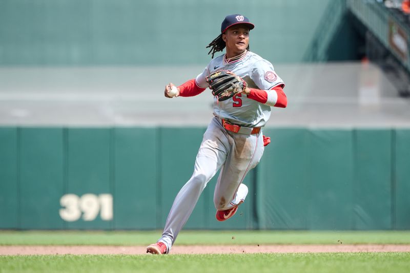 Apr 10, 2024; San Francisco, California, USA; Washington Nationals shortstop CJ Abrams (5) looks to throw the ball against the San Francisco Giants during the sixth inning at Oracle Park. Mandatory Credit: Robert Edwards-USA TODAY Sports