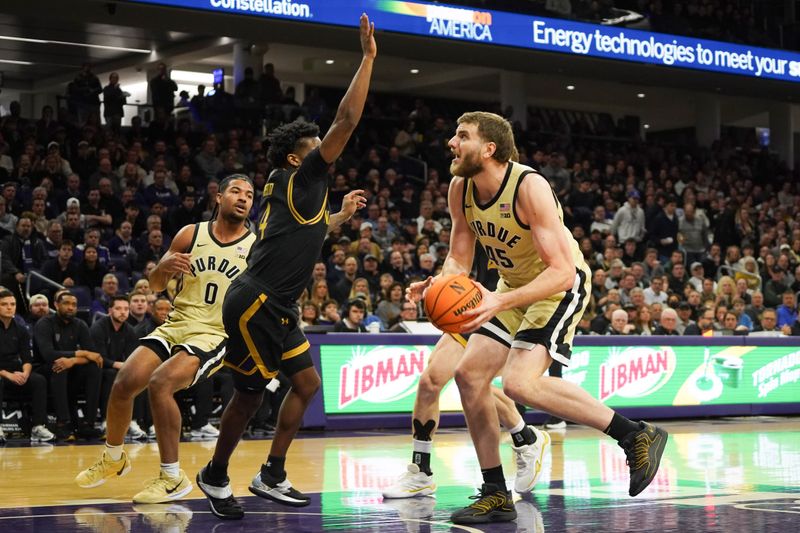 Mar 4, 2026; Evanston, Illinois, USA; Northwestern Wildcats guard Jayden Reid (4) defends Purdue Boilermakers center Oscar Cluff (45) during the first half at Welsh-Ryan Arena. Mandatory Credit: David Banks-Imagn Images