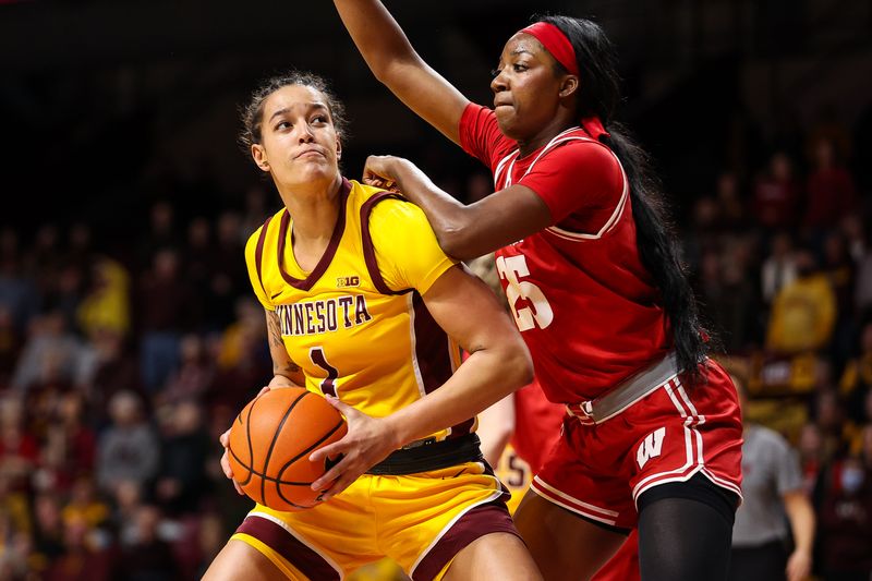 Feb 20, 2024; Minneapolis, Minnesota, USA; Minnesota Golden Gophers forward Ayianna Johnson (1) works towards the basket as Wisconsin Badgers forward Serah Williams (25) defends during the first half at Williams Arena. Mandatory Credit: Matt Krohn-USA TODAY Sports