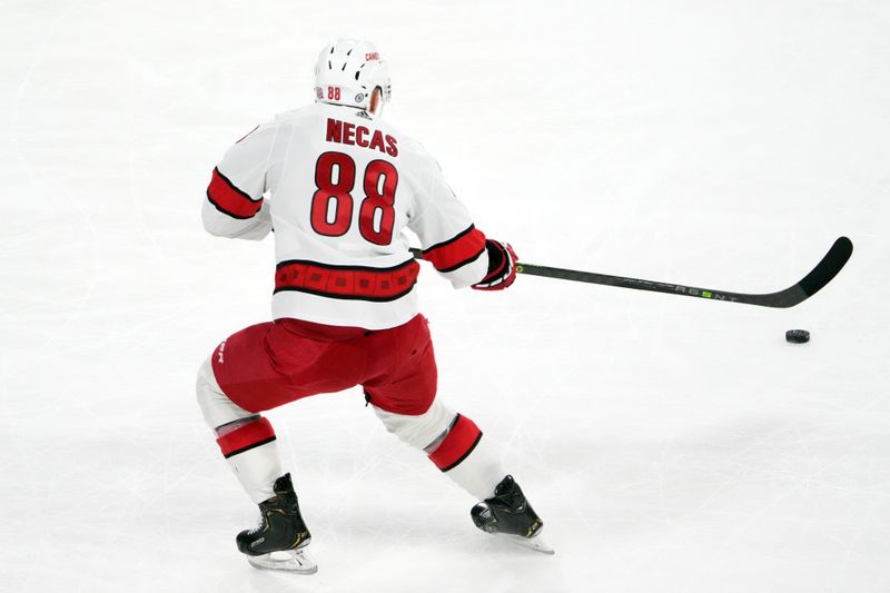 Mar 3, 2023; Tempe, Arizona, USA; Carolina Hurricanes center Martin Necas (88) passes the puck against the Arizona Coyotes during the third period at Mullett Arena. Mandatory Credit: Joe Camporeale-USA TODAY Sports