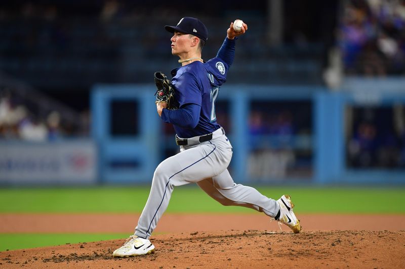 Aug 19, 2024; Los Angeles, California, USA; Seattle Mariners pitcher Bryan Woo (22) throws against the Los Angeles Dodgers at Dodger Stadium. Mandatory Credit: Gary A. Vasquez-USA TODAY Sports