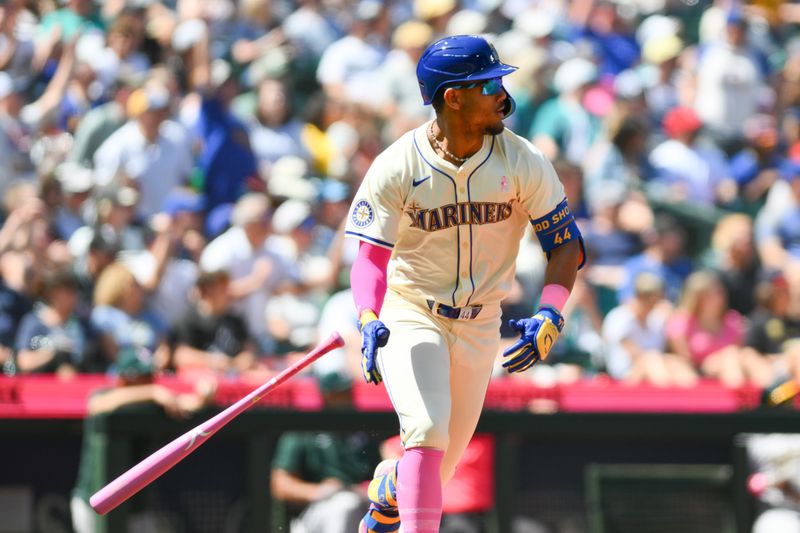 May 12, 2024; Seattle, Washington, USA; Seattle Mariners center fielder Julio Rodriguez (44) runs towards first base after hitting a double against the Oakland Athletics during the fifth inning at T-Mobile Park. Mandatory Credit: Steven Bisig-USA TODAY Sports