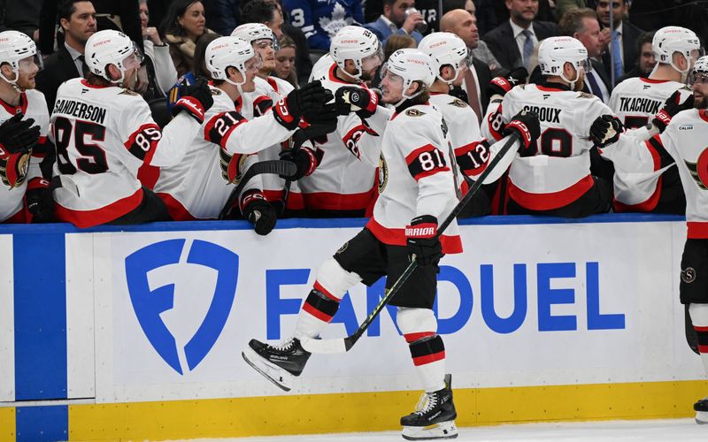 Apr 22, 2025; Toronto, Ontario, CAN;  Ottawa Senators forward Adam Gaudette (81) celebrates with team mates after scoring a goal against the Toronto Maple Leafs in the third period in game two of the first round of the 2025 Stanley Cup Playoffs at Scotiabank Arena. Mandatory Credit: Dan Hamilton-Imagn Images