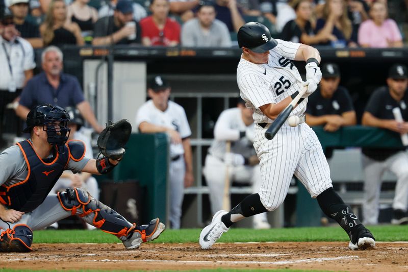 Aug 24, 2024; Chicago, Illinois, USA; Chicago White Sox first baseman Andrew Vaughn (25) hits an RBI-single against the Detroit Tigers during the third inning at Guaranteed Rate Field. Mandatory Credit: Kamil Krzaczynski-USA TODAY Sports