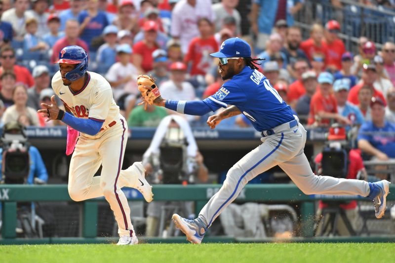 Aug 6, 2023; Philadelphia, Pennsylvania, USA; Philadelphia Phillies center fielder Johan Rojas (18) is tagged out during a rundown by Kansas City Royals third baseman Maikel Garcia (11) during the seventh inning at Citizens Bank Park. Mandatory Credit: Eric Hartline-USA TODAY Sports