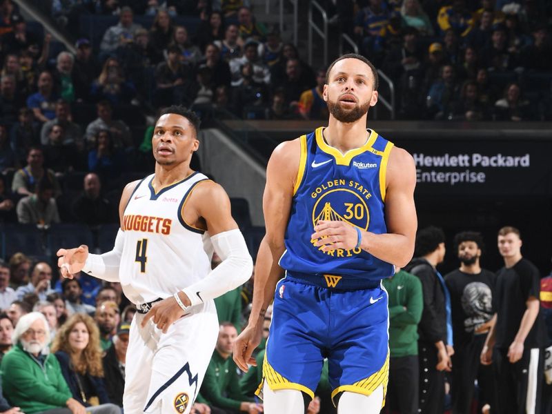 SAN FRANCISCO, CA - MARCH 17: Stephen Curry #30 of the Golden State Warriors and Russell Westbrook #4 of the Denver Nuggets look on during the game between the Denver Nuggets and the Golden State Warriors on March 17, 2025 at Chase Center in San Francisco, California. NOTE TO USER: User expressly acknowledges and agrees that, by downloading and or using this photograph, user is consenting to the terms and conditions of Getty Images License Agreement. Mandatory Copyright Notice: Copyright 2025 NBAE (Photo by Noah Graham/NBAE via Getty Images)