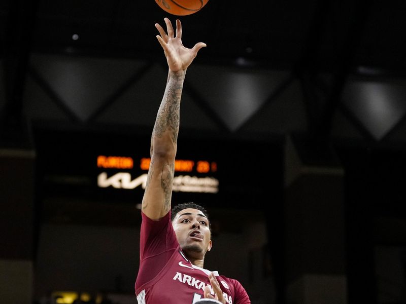 Jan 31, 2024; Columbia, Missouri, USA; Arkansas Razorbacks forward Jalen Graham (11) shoots over Missouri Tigers guard Curt Lewis (4) during the second half at Mizzou Arena. Mandatory Credit: Jay Biggerstaff-USA TODAY Sports