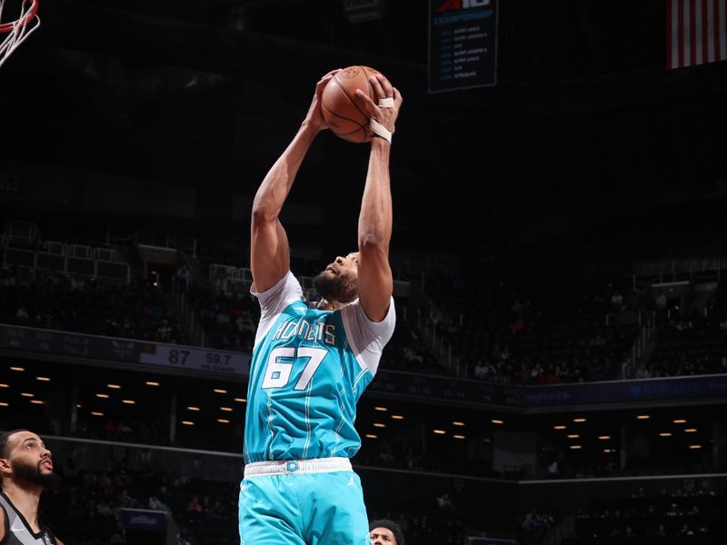 BROOKLYN, NY - FEBRUARY 10: Taj Gibson #67 of the Charlotte Hornets goes up for the rebound during the game against the Brooklyn Nets on February 10, 2025 at Barclays Center in Brooklyn, New York. NOTE TO USER: User expressly acknowledges and agrees that, by downloading and or using this Photograph, user is consenting to the terms and conditions of the Getty Images License Agreement. Mandatory Copyright Notice: Copyright 2025 NBAE (Photo by Nathaniel S. Butler/NBAE via Getty Images)