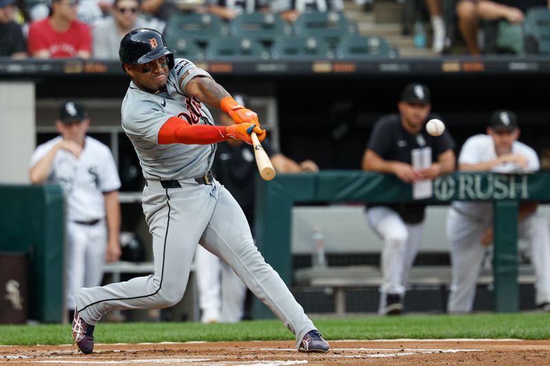 Aug 24, 2024; Chicago, Illinois, USA; Detroit Tigers second baseman Andy Ibanez (77) hits an RBI-single against the Chicago White Sox during the first inning at Guaranteed Rate Field. Mandatory Credit: Kamil Krzaczynski-USA TODAY Sports