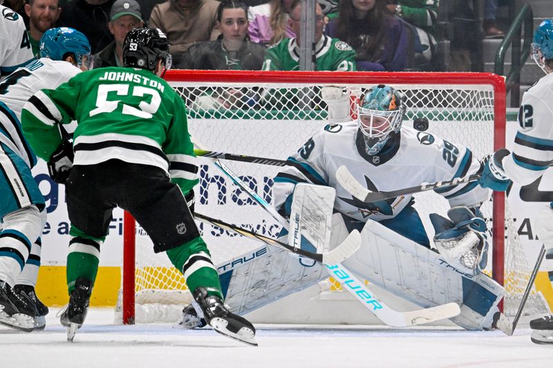 Nov 20, 2024; Dallas, Texas, USA; Dallas Stars center Wyatt Johnston (53) shoots a wrist shot against San Jose Sharks goaltender Mackenzie Blackwood (29) during the third period at the American Airlines Center. Mandatory Credit: Jerome Miron-Imagn Images