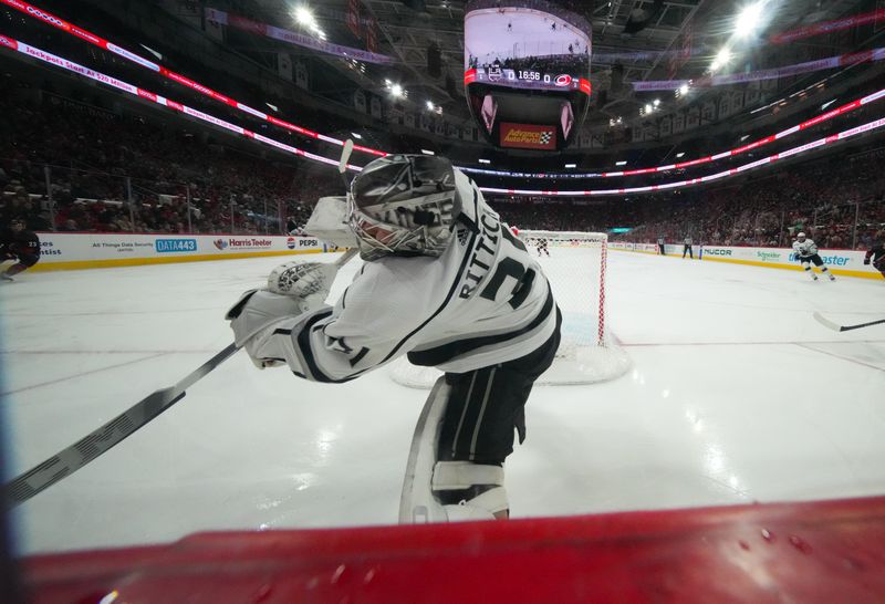 Jan 15, 2024; Raleigh, North Carolina, USA;  Los Angeles Kings goaltender David Rittich (31) clears the puck against Carolina Hurricanes during the third period at PNC Arena. Mandatory Credit: James Guillory-USA TODAY Sports