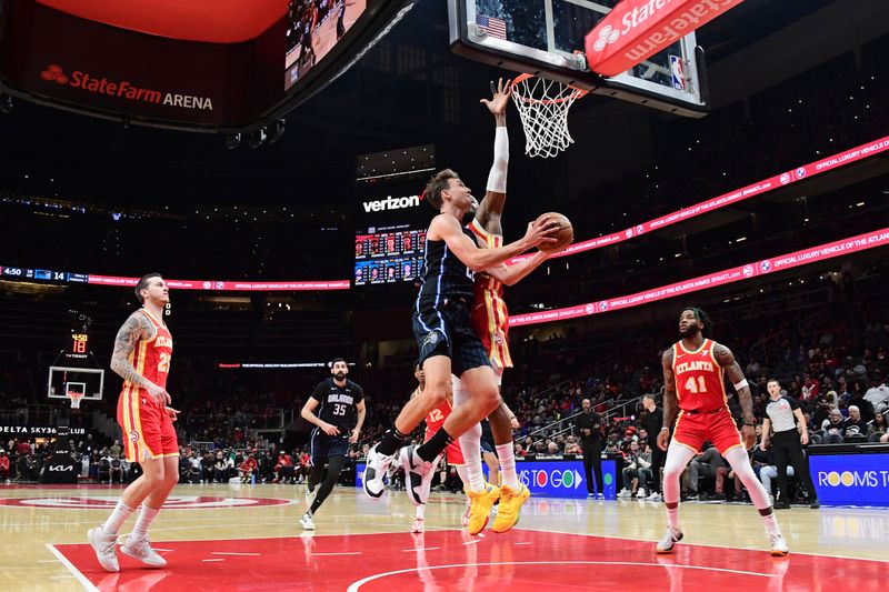 ATLANTA, GA - FEBRUARY 25: Franz Wagner #22 of the Orlando Magic shoots the ball during the game against the Atlanta Hawks on February 25, 2024 at State Farm Arena in Atlanta, Georgia.  NOTE TO USER: User expressly acknowledges and agrees that, by downloading and/or using this Photograph, user is consenting to the terms and conditions of the Getty Images License Agreement. Mandatory Copyright Notice: Copyright 2024 NBAE (Photo by Scott Cunningham/NBAE via Getty Images)