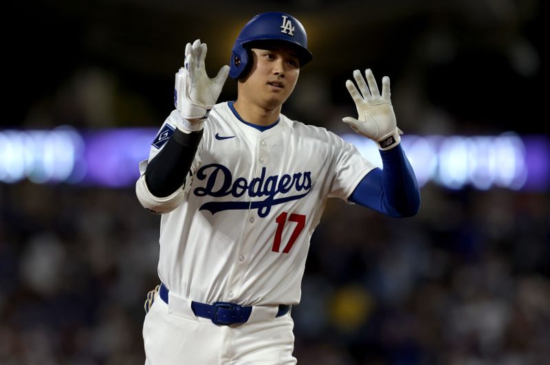 May 30, 2025; Los Angeles, California, USA; Los Angeles Dodgers designated hitter Shohei Ohtani (17) rounds the bases after hitting a home run during the sixth inning against the New York Yankees at Dodger Stadium. Mandatory Credit: Jason Parkhurst-Imagn Images