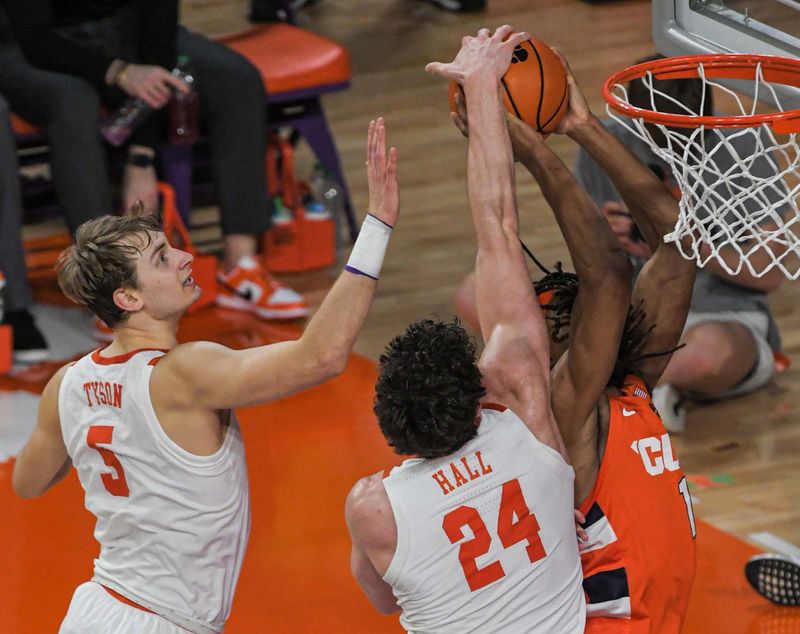 Feb 22, 2023; Clemson, South Carolina, USA; Clemson forward PJ Hall (24) blocks the shot of Syracuse forward Maliq Brown (1) during the first half at Littlejohn Coliseum. Mandatory Credit: Ken Ruinard-USA TODAY Sports