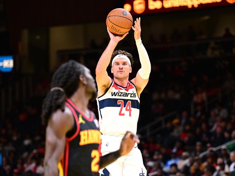 ATLANTA, GA - NOVEMBER 15:  Corey Kispert #24 of the Washington Wizards shoots the ball during the game against the Atlanta Hawks during the Emirates NBA Cup game on November 15, 2024 at State Farm Arena in Atlanta, Georgia.  NOTE TO USER: User expressly acknowledges and agrees that, by downloading and/or using this Photograph, user is consenting to the terms and conditions of the Getty Images License Agreement. Mandatory Copyright Notice: Copyright 2024 NBAE (Photo by Adam Hagy/NBAE via Getty Images)