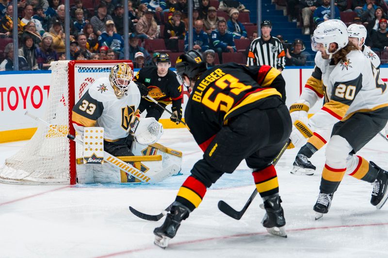 Apr 6, 2025; Vancouver, British Columbia, CAN; Vegas Golden Knights goalie Adin Hill (33) makes a save on Vancouver Canucks forward Teddy Blueger (53) in the second period at Rogers Arena. Mandatory Credit: Bob Frid-Imagn Images