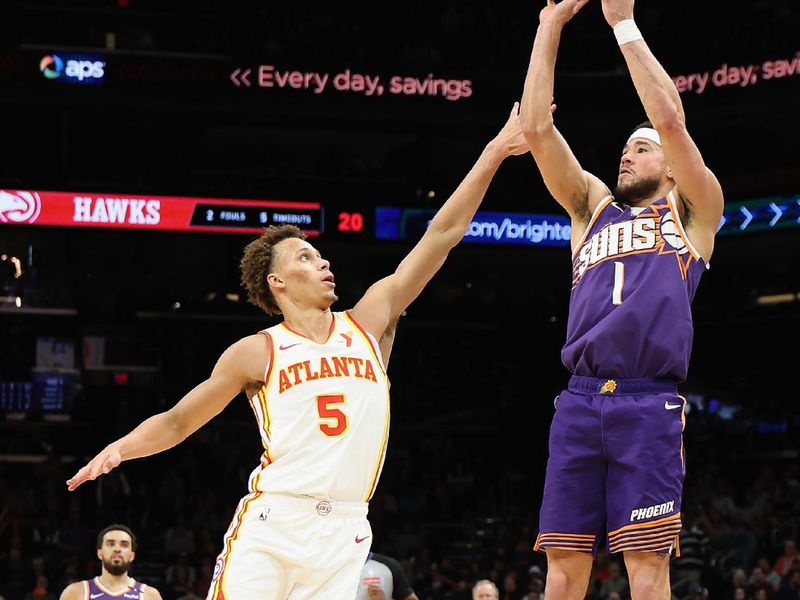 PHOENIX, ARIZONA - JANUARY 09: Devin Booker #1 of the Phoenix Suns attempts a shot over Dyson Daniels #5 of the Atlanta Hawks during the first half of the NBA game at Footprint Center on January 09, 2025 in Phoenix, Arizona. NOTE TO USER: User expressly acknowledges and agrees that, by downloading and or using this photograph, User is consenting to the terms and conditions of the Getty Images License Agreement.  (Photo by Christian Petersen/Getty Images)