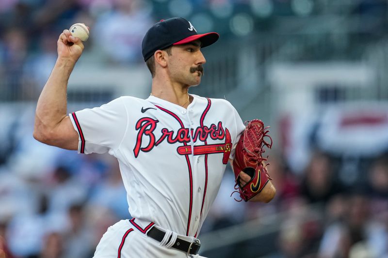 Apr 12, 2023; Cumberland, Georgia, USA; Atlanta Braves starting pitcher Spencer Strider (99) pitches against the Cincinnati Reds during the first inning at Truist Park. Mandatory Credit: Dale Zanine-USA TODAY Sports