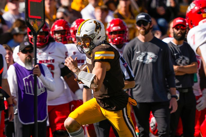 Sep 30, 2023; Laramie, Wyoming, USA; Wyoming Cowboys quarterback Andrew Peasley (6) runs against the New Mexico Lobos during the second quarter at Jonah Field at War Memorial Stadium. Mandatory Credit: Troy Babbitt-USA TODAY Sports

