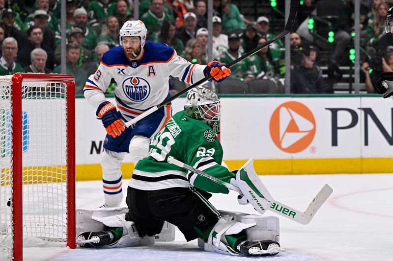 May 21, 2025; Dallas, Texas, USA;Edmonton Oilers center Leon Draisaitl (29) scores a goal against Dallas Stars goaltender Jake Oettinger (29) in the first period during game one of the Western Conference Final of the 2025 Stanley Cup Playoffs at American Airlines Center. Mandatory Credit: Jerome Miron-Imagn Images