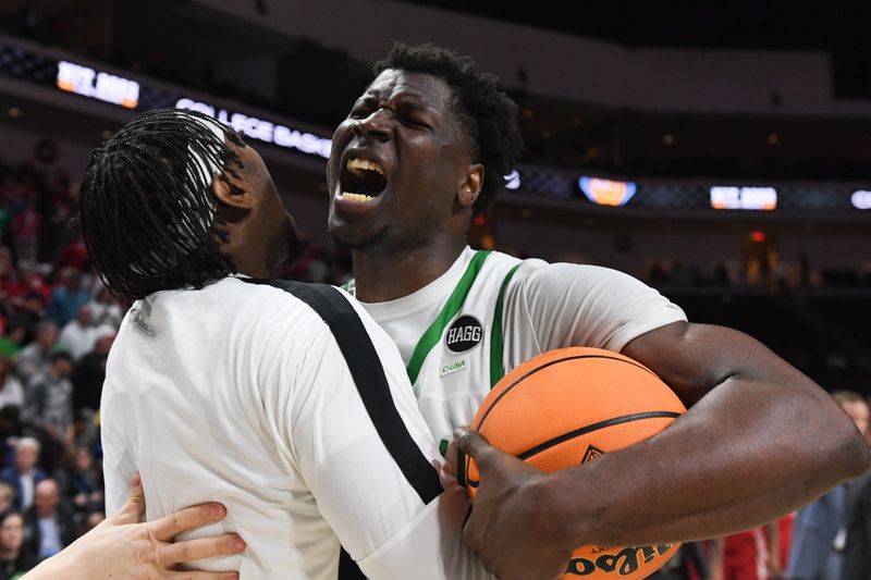 Mar 28, 2023; Las Vegas, NV, USA; North Texas Mean Green forward Moulaye Sissoko (14) celebrates the victory against the Wisconsin Badgers at Orleans Arena. Mandatory Credit: Candice Ward-USA TODAY Sports