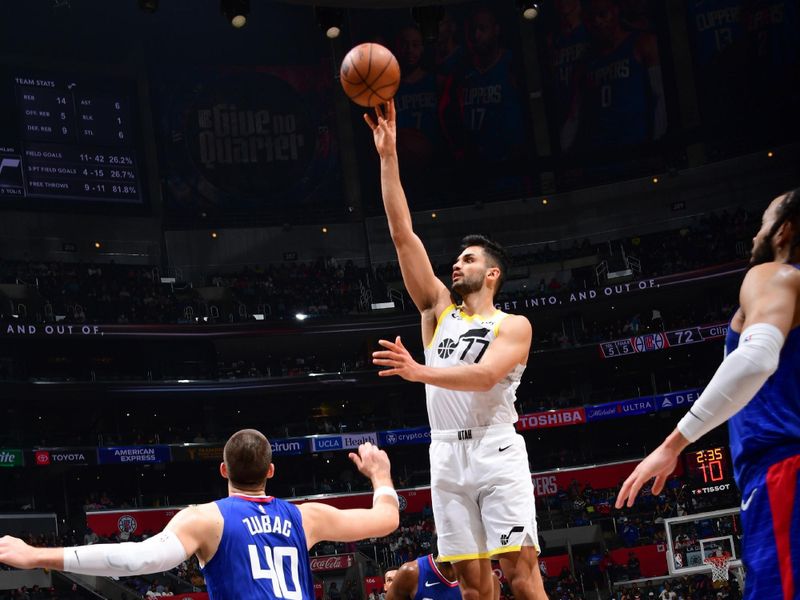 LOS ANGELES, CA - APRIL 5:  Omer Yurtseven #77 of the Utah Jazz goes to the basket during the game on April 5, 2024 at Crypto.Com Arena in Los Angeles, California. NOTE TO USER: User expressly acknowledges and agrees that, by downloading and/or using this Photograph, user is consenting to the terms and conditions of the Getty Images License Agreement. Mandatory Copyright Notice: Copyright 2024 NBAE (Photo by Adam Pantozzi/NBAE via Getty Images)