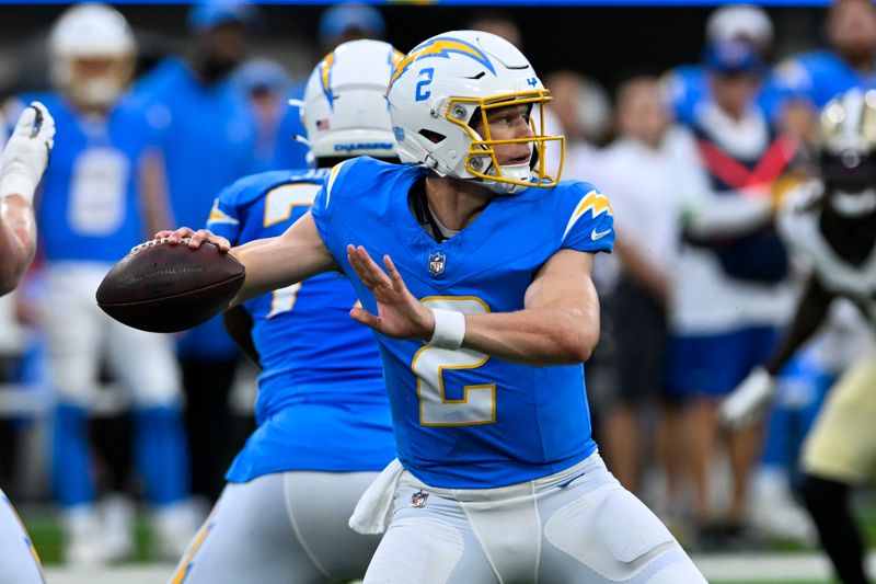 Los Angeles Chargers quarterback Easton Stick (2) drops back to pass in the first half of an NFL football game against the New Orleans Saints in Inglewood, Calif., Sunday, Aug. 20, 2023. (AP Photo/Alex Gallardo)