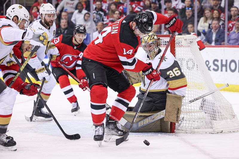 Jan 22, 2024; Newark, New Jersey, USA; New Jersey Devils right wing Nathan Bastian (14) plays the puck in front of Vegas Golden Knights goaltender Logan Thompson (36) during the first period at Prudential Center. Mandatory Credit: Vincent Carchietta-USA TODAY Sports