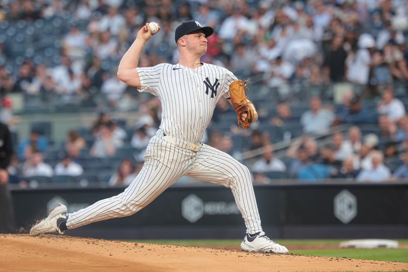 May 21, 2024; Bronx, New York, USA; New York Yankees starting pitcher Clarke Schmidt (36) delivers a pitch during the third inning against the Seattle Mariners at Yankee Stadium. Mandatory Credit: Vincent Carchietta-USA TODAY Sports