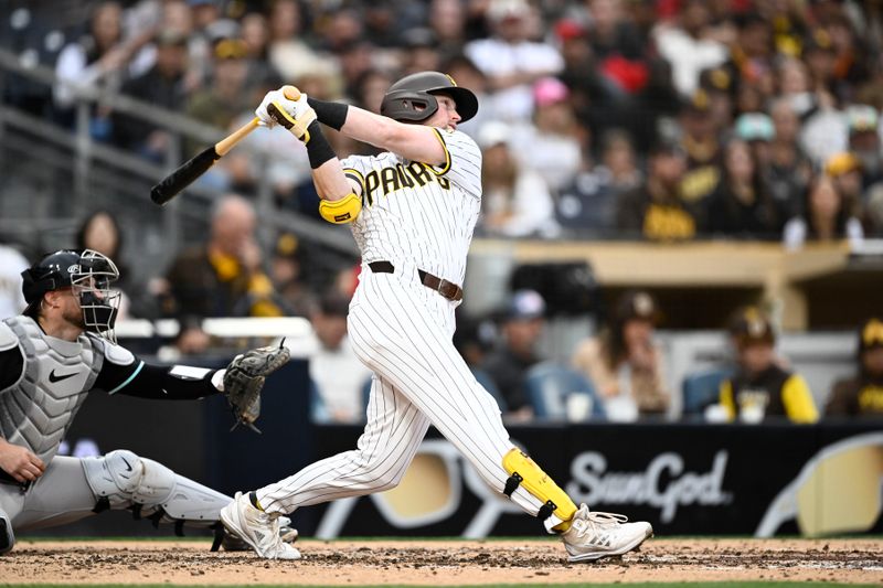 Jun 8, 2024; San Diego, California, USA; San Diego Padres first baseman Jake Cronenworth (9) hits a three-run home run during the fourth inning against the San Diego Padres at Petco Park. Mandatory Credit: Denis Poroy-USA TODAY Sports at Petco Park. 