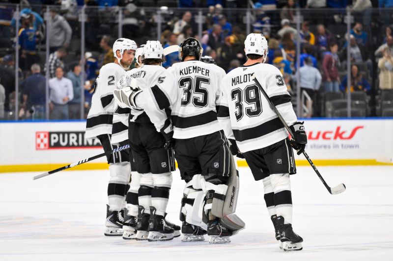 Oct 21, 2025; St. Louis, Missouri, USA; Los Angeles Kings goaltender Darcy Kuemper (35) celebrates with teammates after the Kings defeated the St. Louis Blues in overtime at Enterprise Center. Mandatory Credit: Jeff Curry-Imagn Images