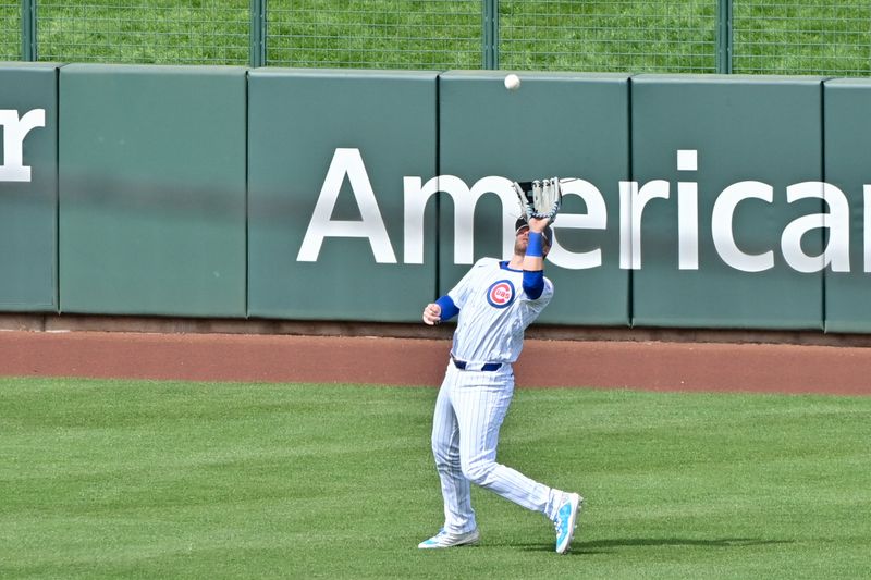 Feb 27, 2024; Mesa, Arizona, USA;  Chicago Cubs left fielder Ian Happ (8) catches a fly ball in the third inning against the Cincinnati Reds during a spring training game at Sloan Park. Mandatory Credit: Matt Kartozian-USA TODAY Sports